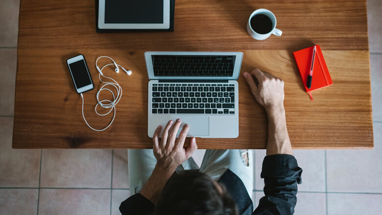 Man at desk with laptop