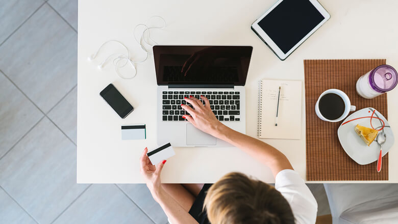 woman on laptop with credit card