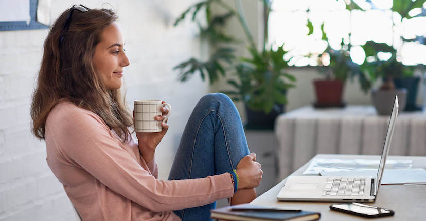 woman at desk with coffee