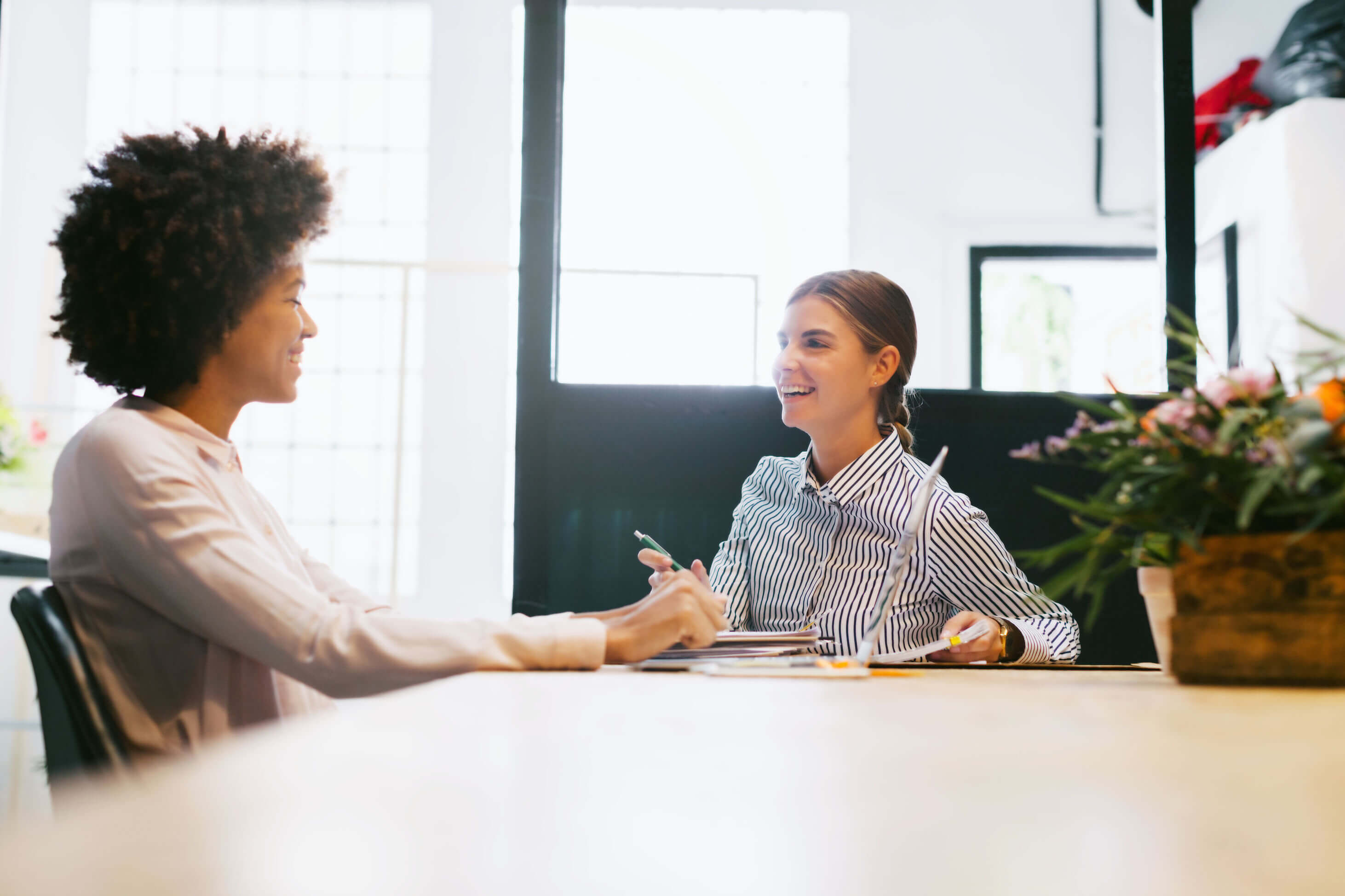 women talking at table