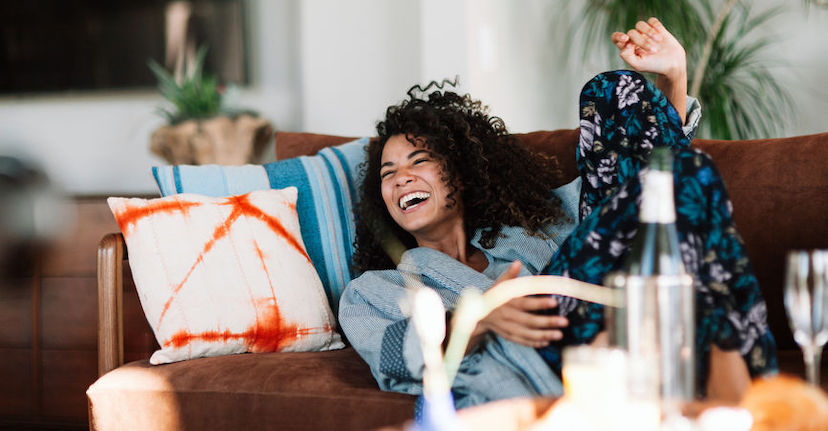 Young Woman Laughing on couch