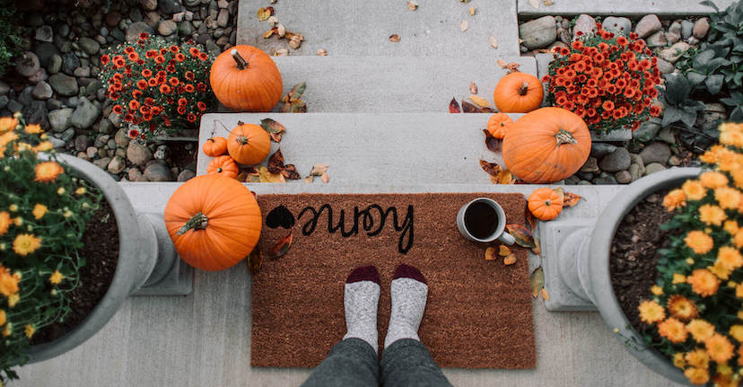 fall doormat and pumpkins