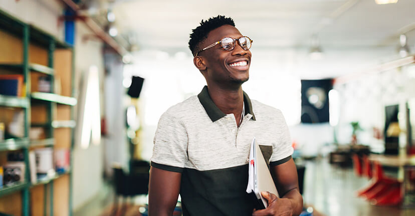 man smiling in his office