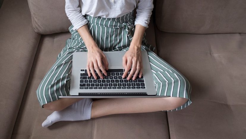 3 Ways To Upgrade Your Virtual Job Hunting Game: Woman working on couch