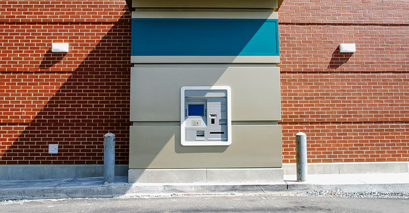 atm on brick building