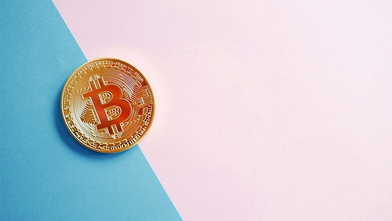 bitcoin on blue and pink background