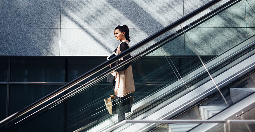 woman on escalator