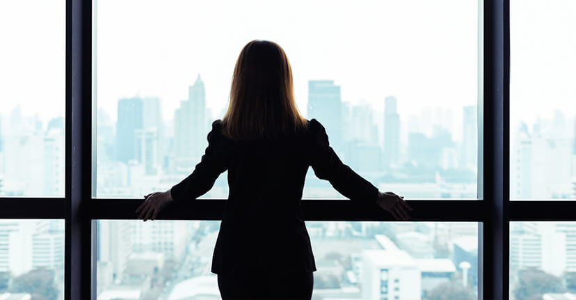 businesswoman looking out woman