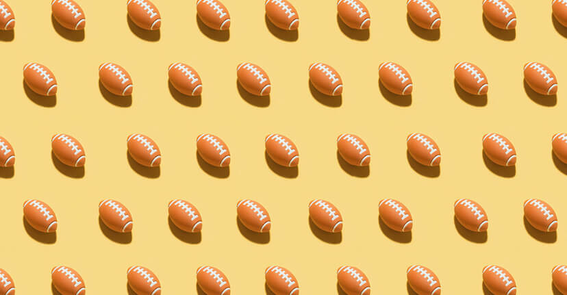 footballs on yellow background