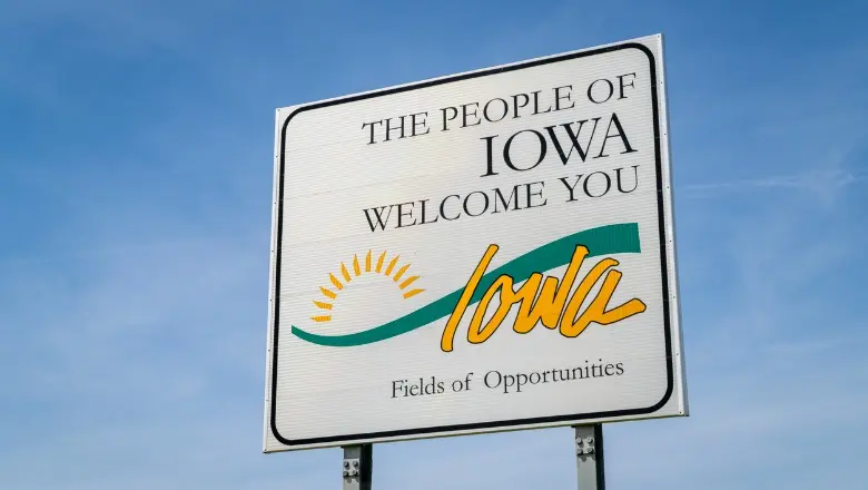 A roadside sign reads: 