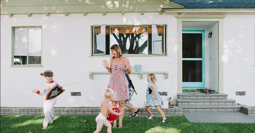 mother with children outside house