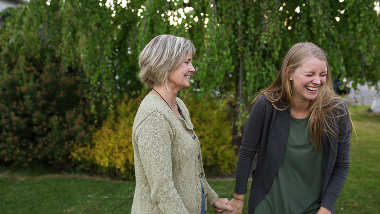 mother and daughter laughing