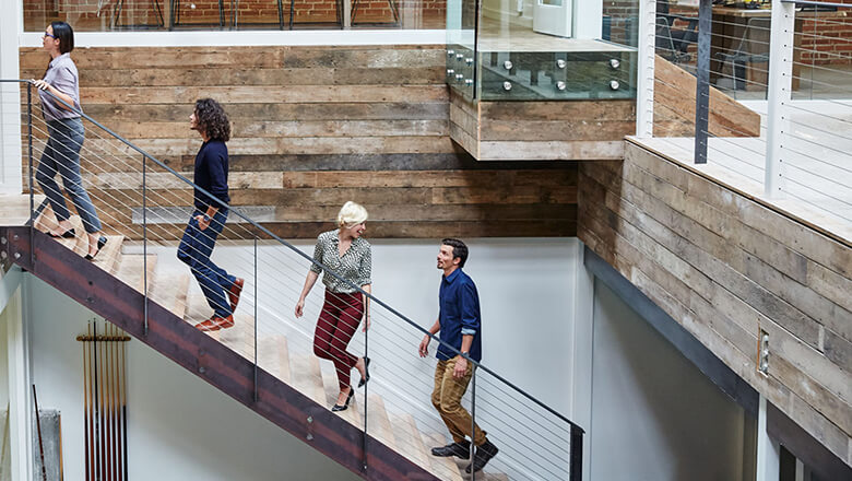 co-workers on office stairs