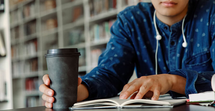 Man studying in college library