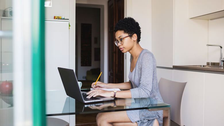 woman sitting at a desk working