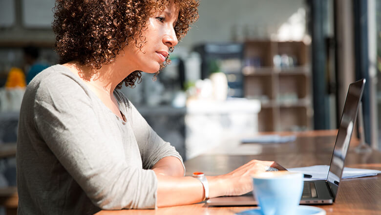 woman in cafe on laptop