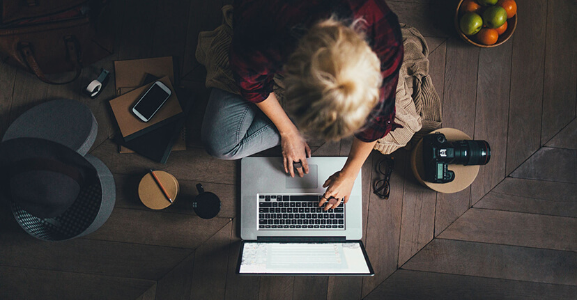 overhead of woman on laptop