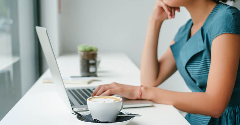 woman on laptop with coffee