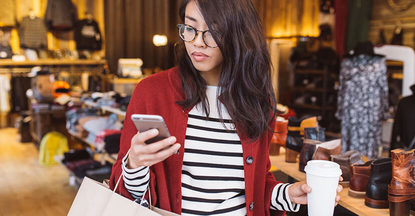 woman in boutique on phone