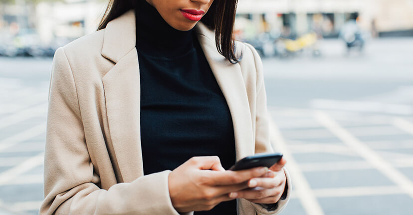 Woman on smartphone on street